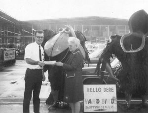 Dick Baker giving a club bonus chek to Mary Robinson