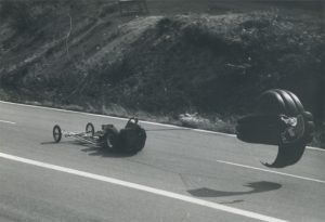 Parachute with a Yard Birds Head is slowing down the dragster.